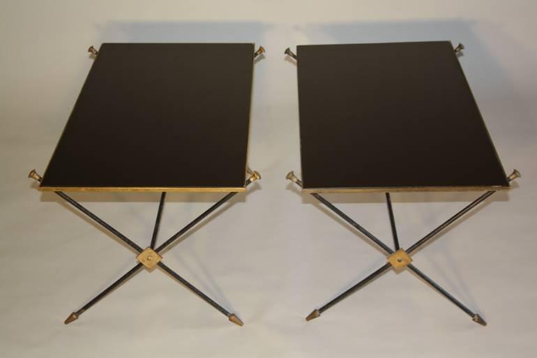A pair of black vitrolite, crossed arrow 1950`s French end tables.