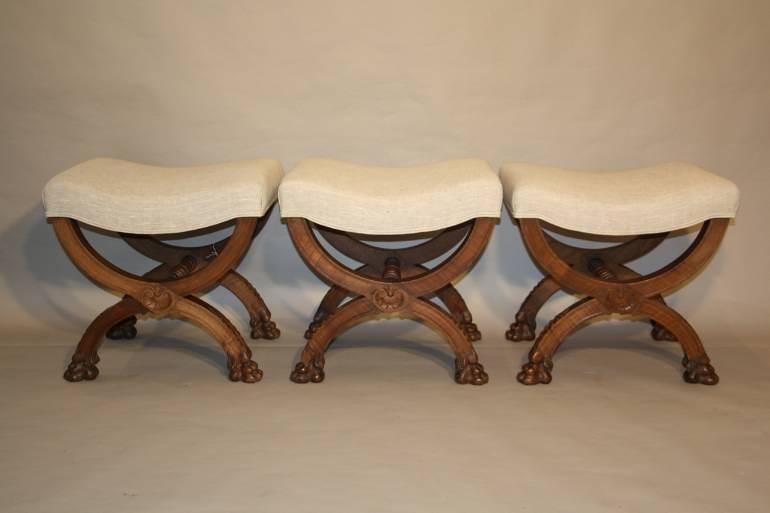 Three carved wood Lion feet stools