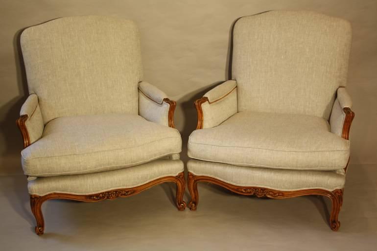 A pair of carved wood French fauteuils