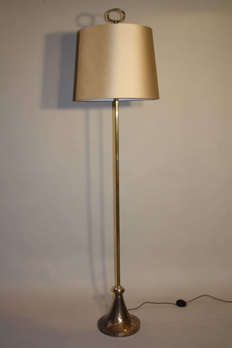A silver floor lamp, c1950
