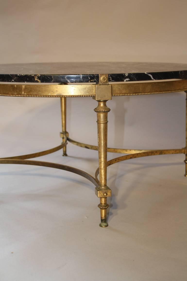 Gilt metal and black marble circular occasional table, French c1950