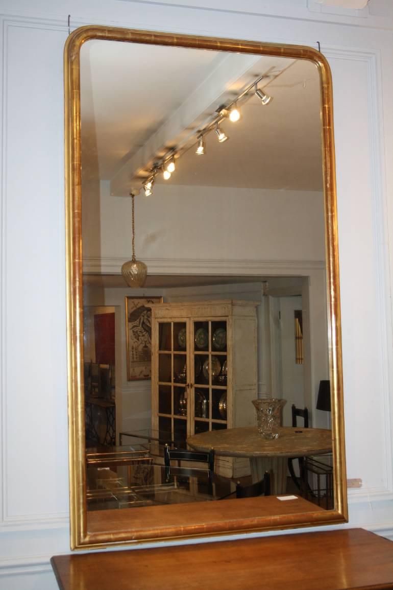 A large gilt gesso overmantle mirror