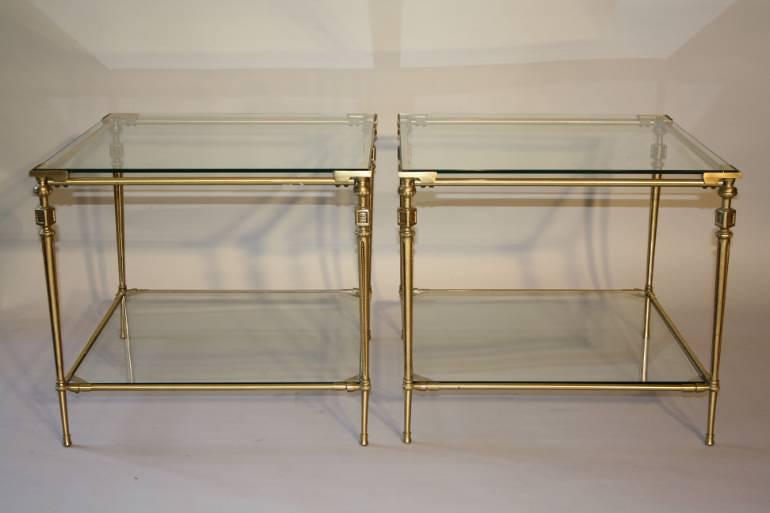 A pair of two tier brass side tables, French c1970