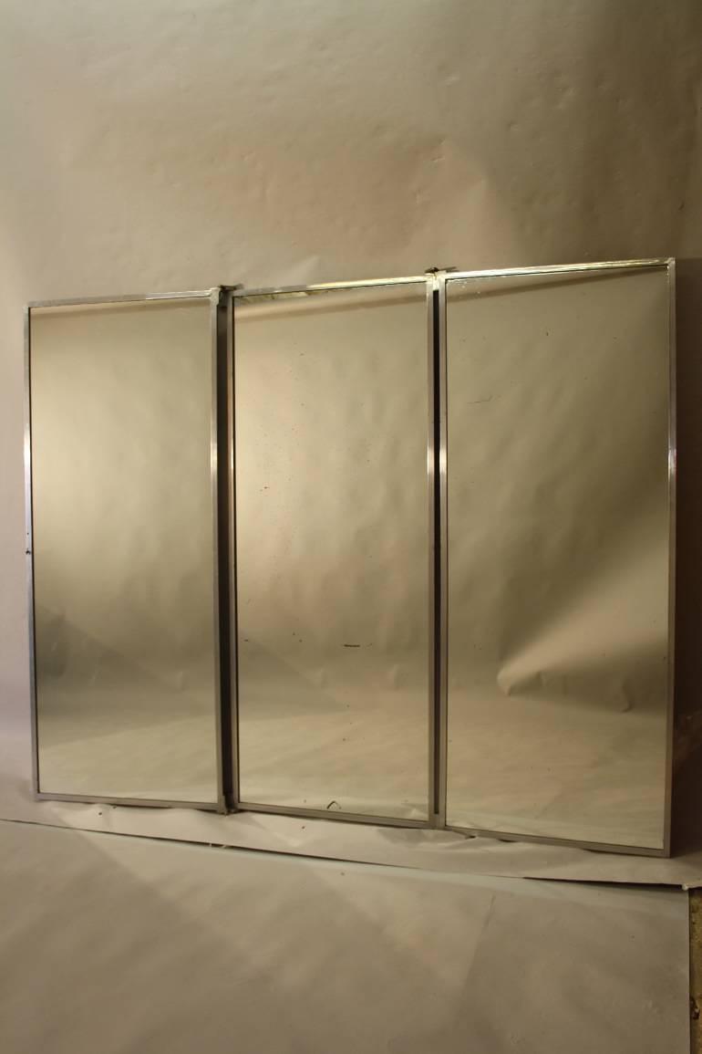 A silver aluminium triptych Brot style mirror. French c1950