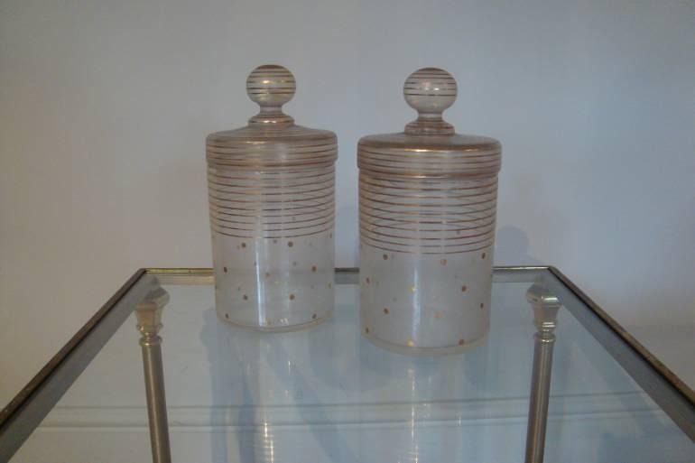 Pair of glass and painted gold lidded jars, c1930