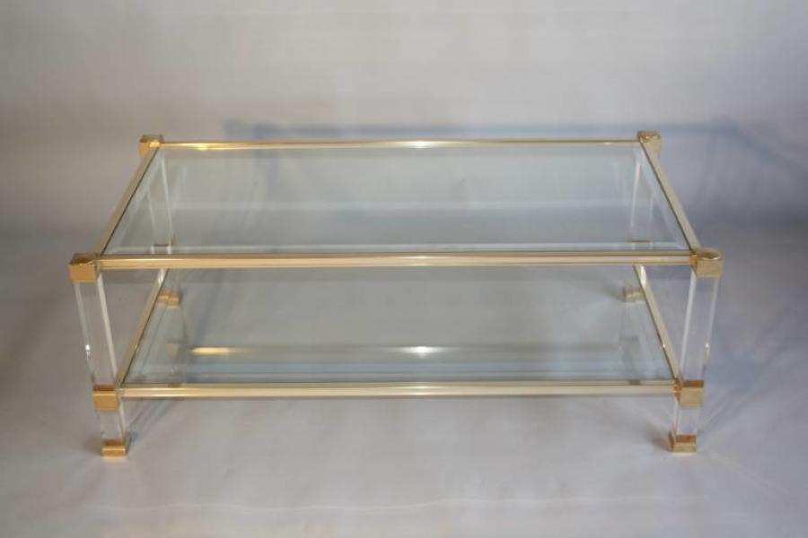 A lucite framed and glass two tier coffee table