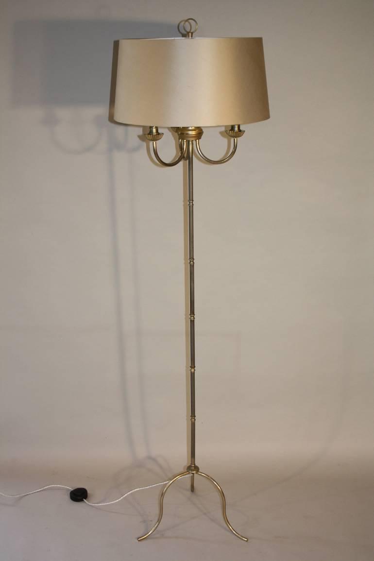 A silver and gold bamboo floor light