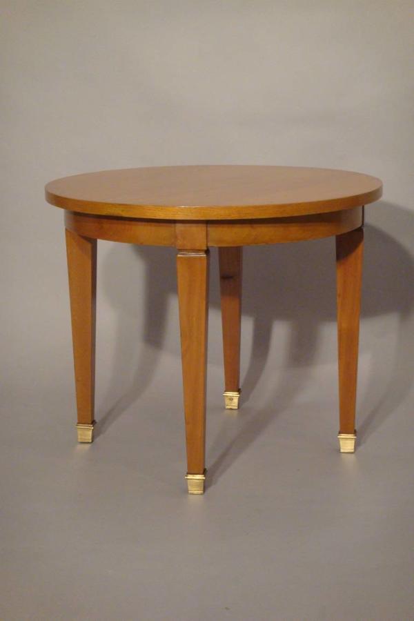 A small beechwood occasional table, attributed to Jacques Adnet, French c1950