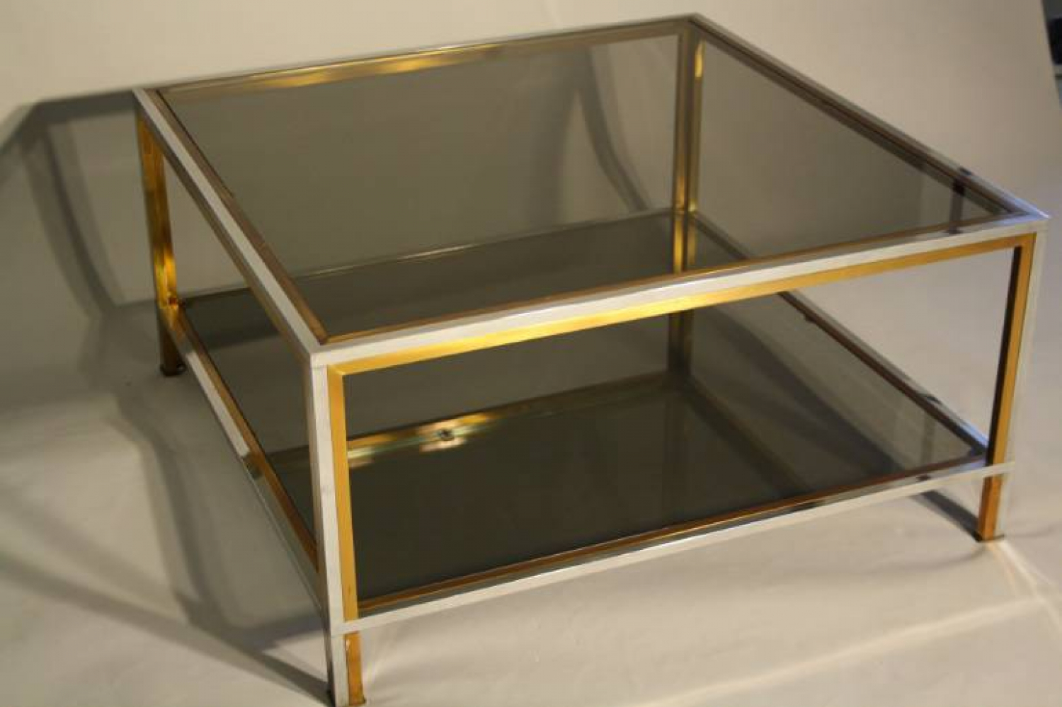 A square silver and brass smoked glass two ti