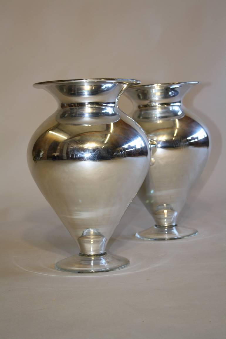 A pair of silver mirror glass vases, C20th