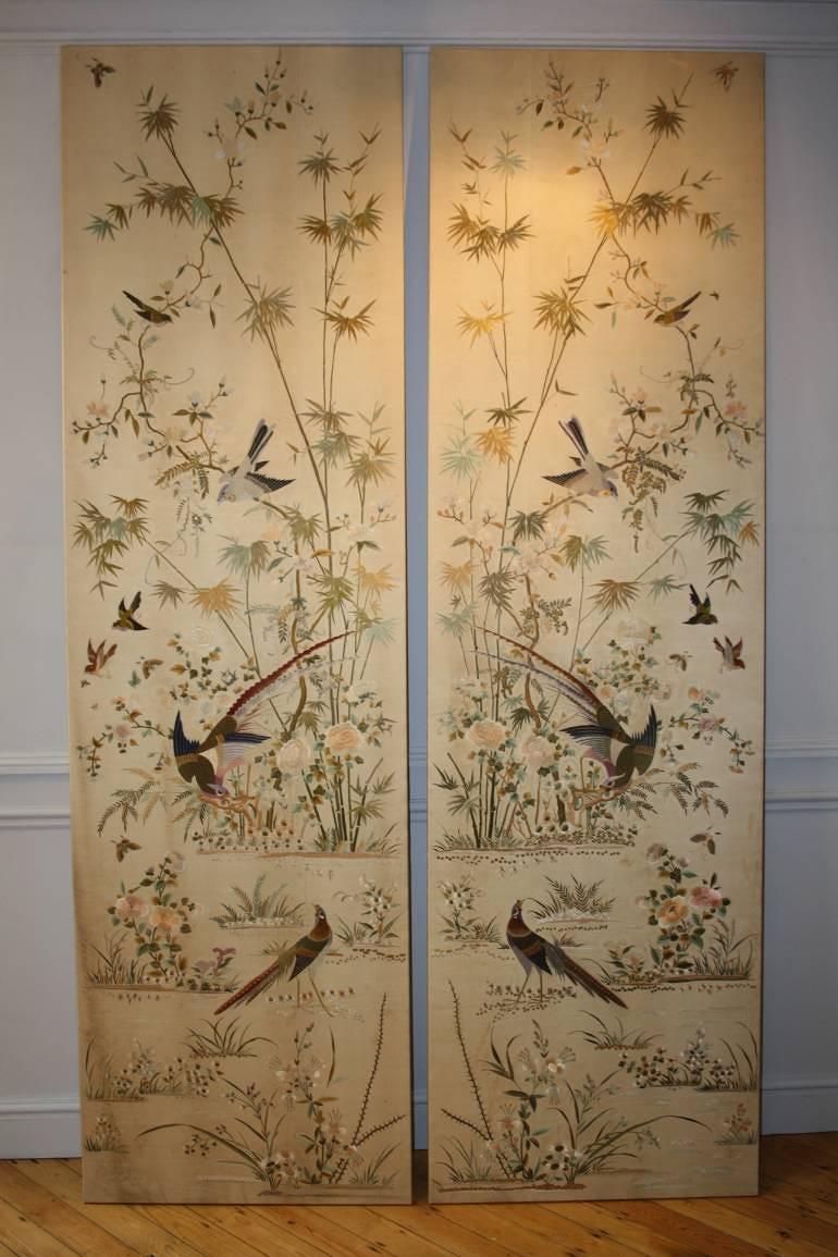 A pair of hand embroidered silk panels, c1900