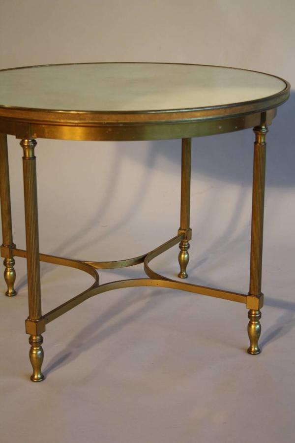 A circular brass and mirror glass occasional table, French c1950