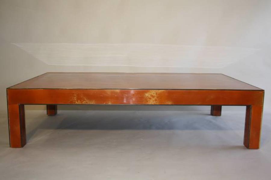 Vintage 1970`s orange and gold lacquered coffee table.