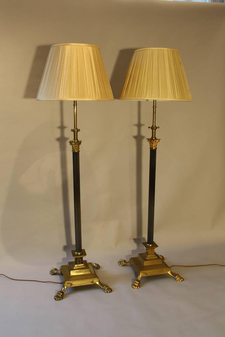 A pair of telescopic, brass lion paw floor lamps, English c1920