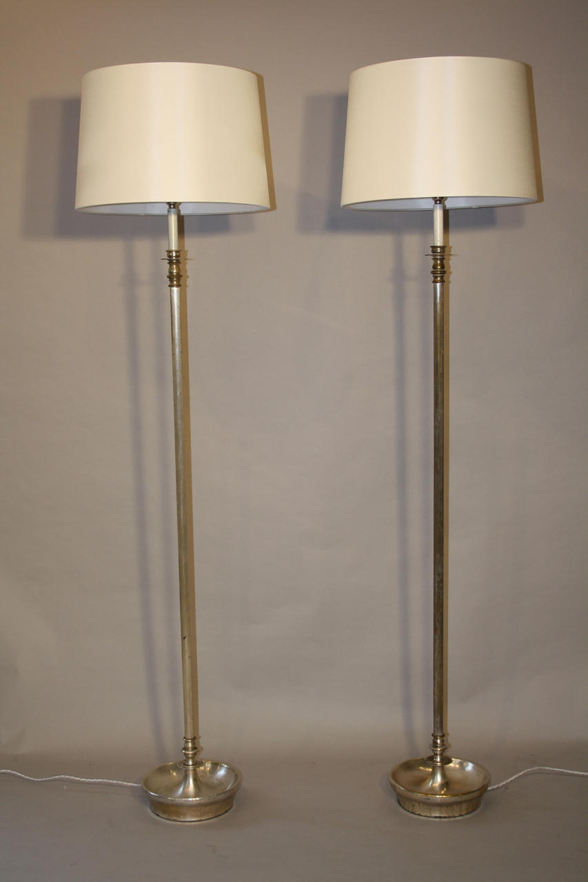 Pair a silver floor lamps