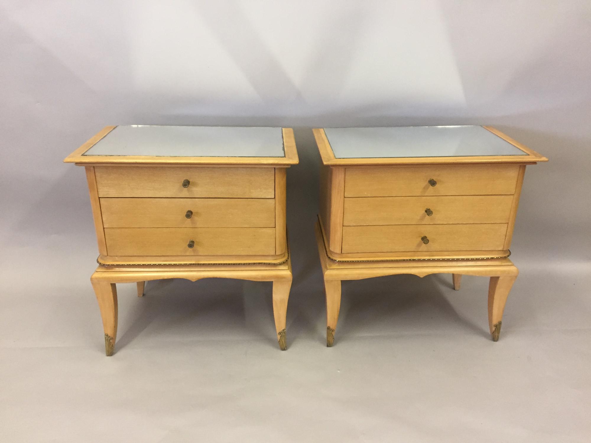 A pair of pale fruitwood side tables