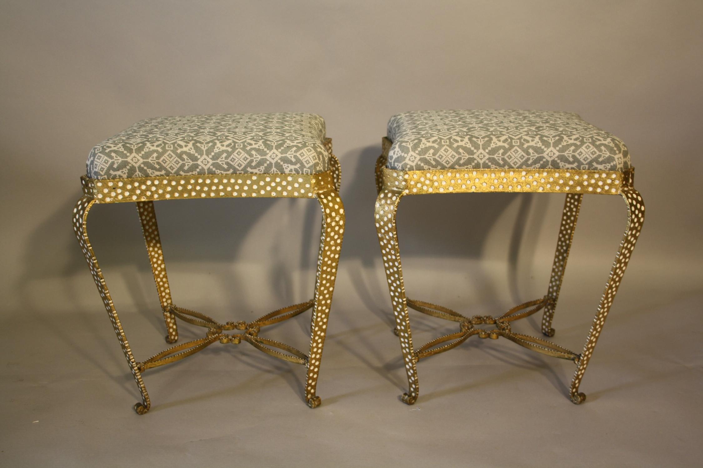 A pair of gilt metal stools