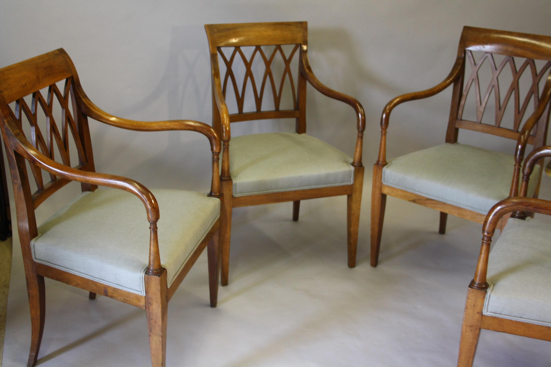 Set of four walnut dining chairs