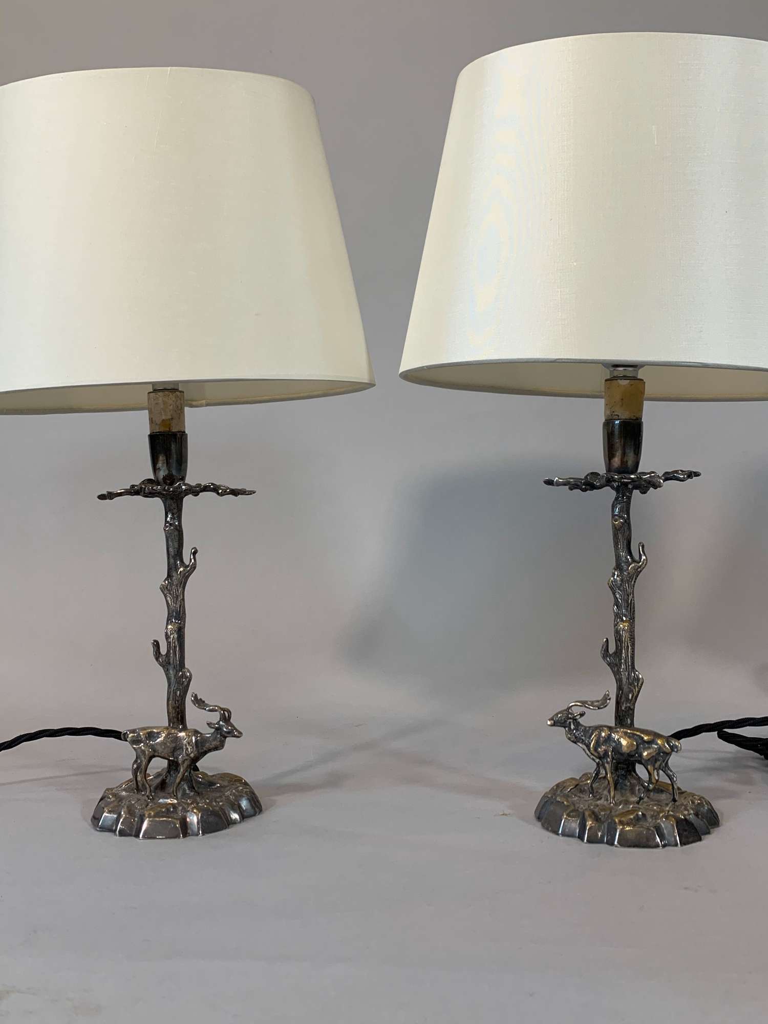 Pair of small silver metal stag lamps