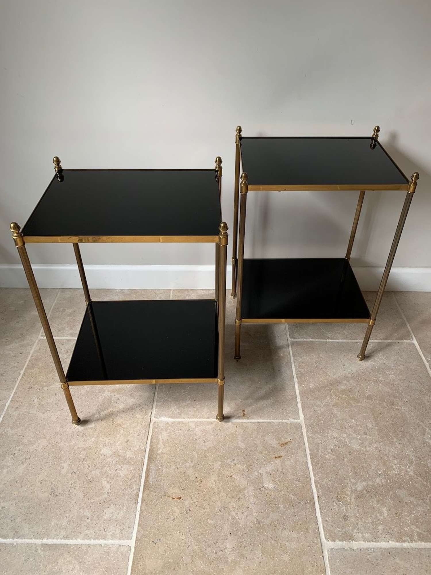 Pair of black vitrolite glass and brass side tables
