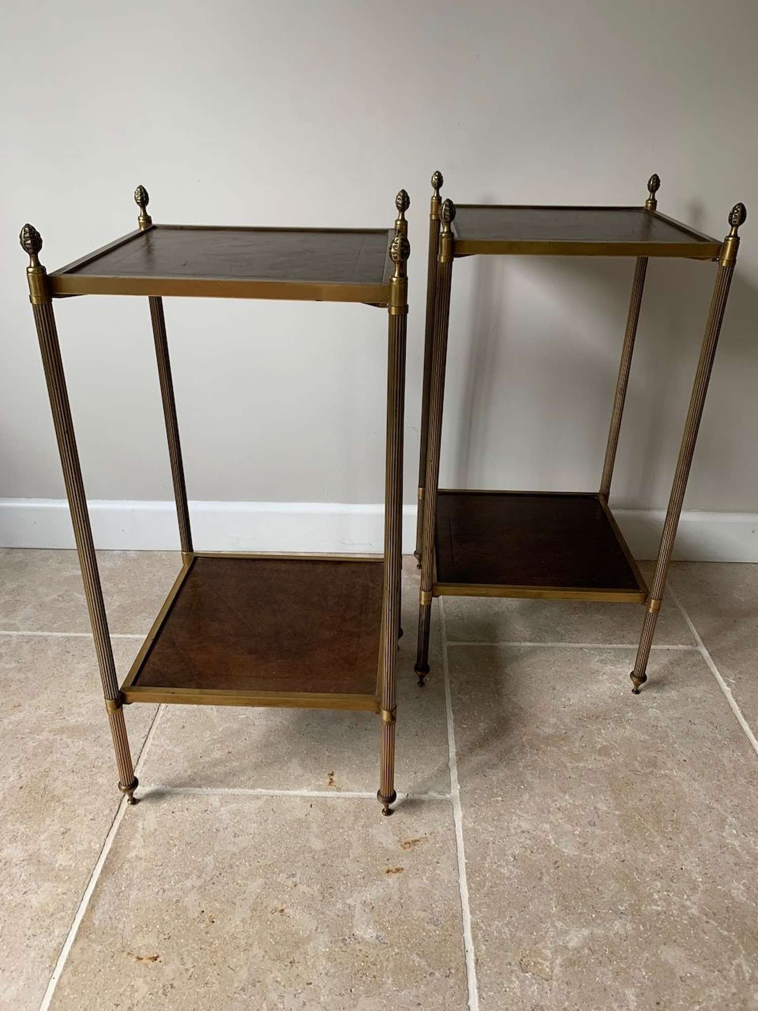 Pair of leather and brass side tables