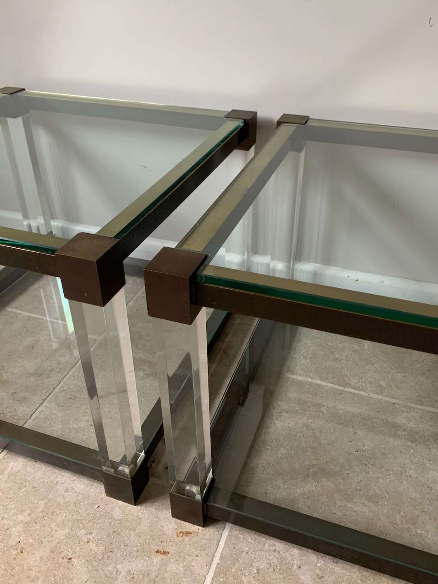 Pair of two tier lucite and glass side tables