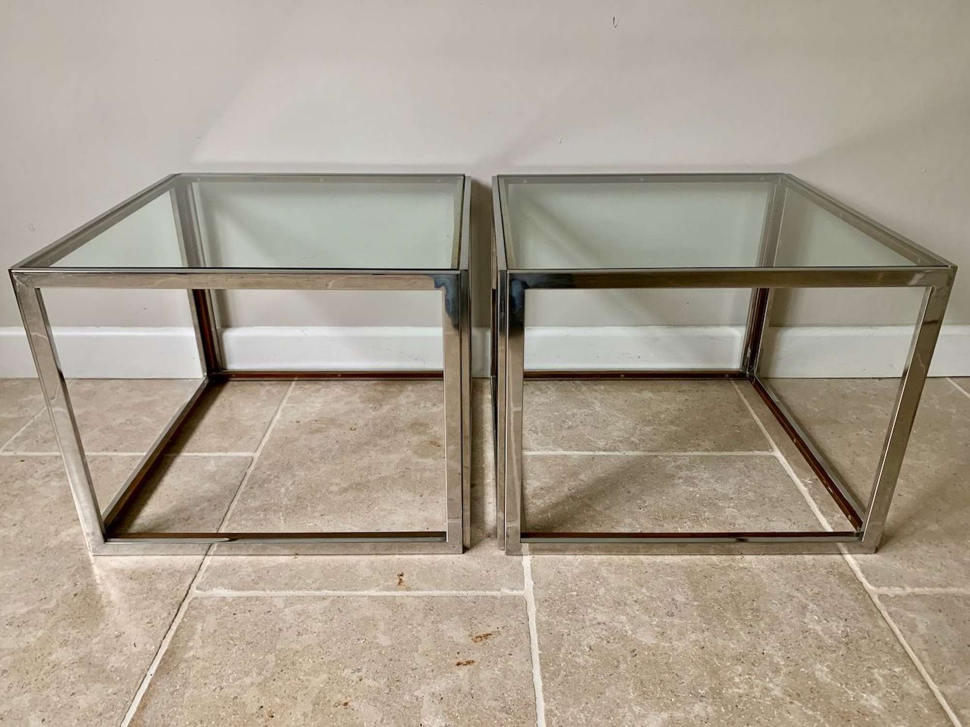 Pair of silver and gold metal side tables