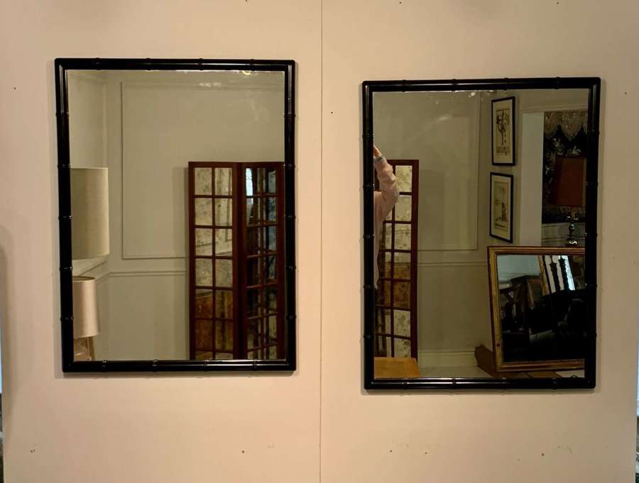 Pair of ebonised bamboo mirrors