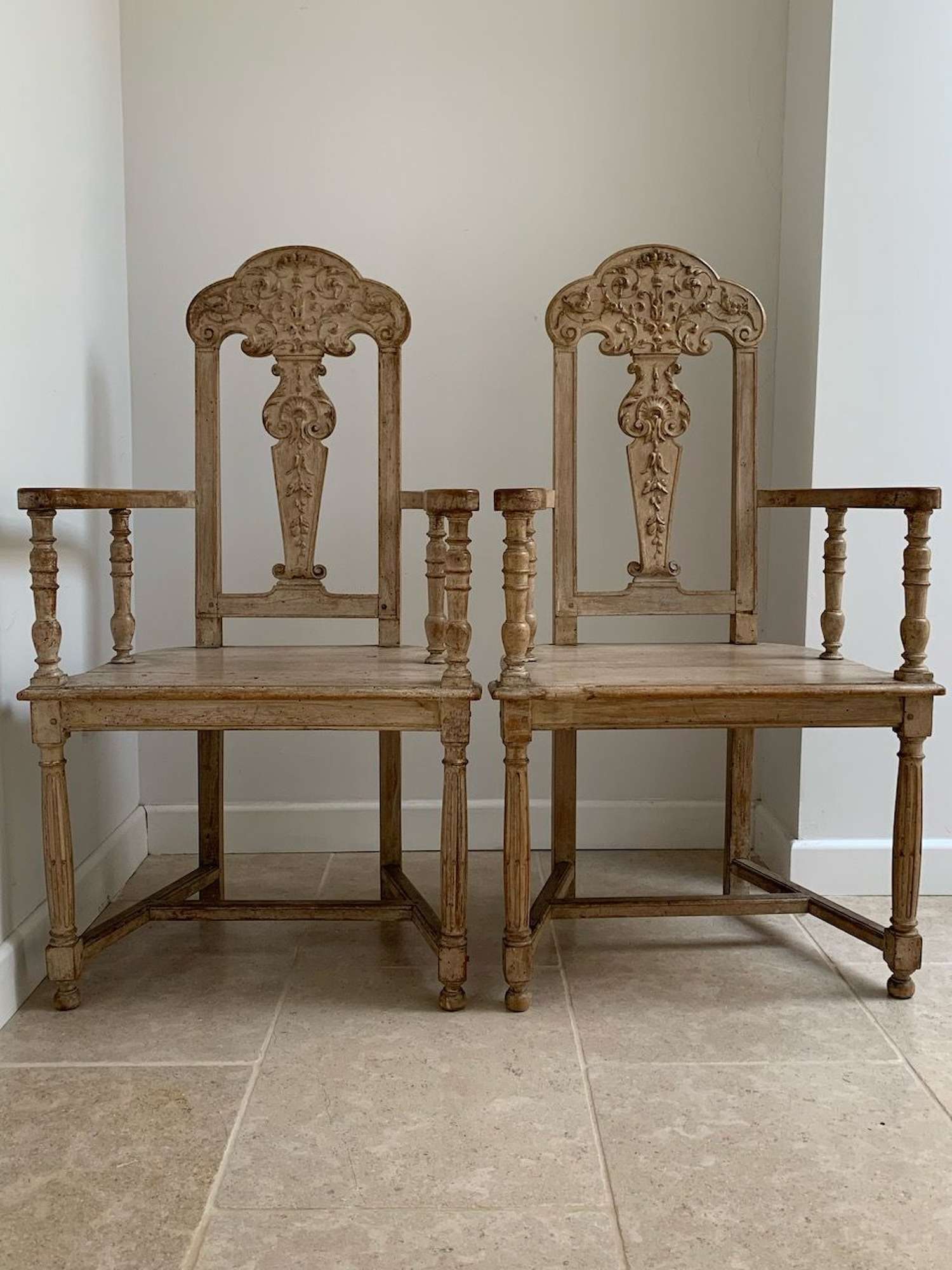 Pair carved and limed walnut chairs